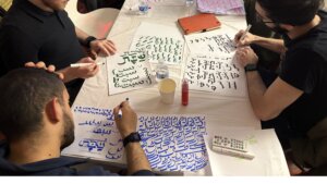 Sacred Script fellows practicing their Hebrew and Arabic calligraphy 