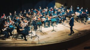 Tom Cohen conducts the youth program of The Jerusalem Orchestra East & West in Tel Aviv, May 2026. (Yaakov Buta)