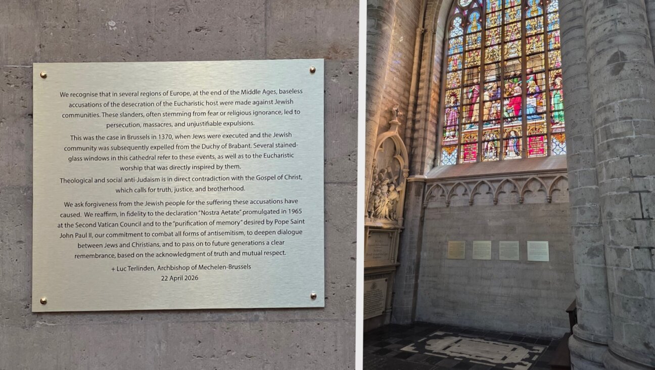 Plaques installed in April 2026 inside the Cathedral of St Michael in Brussels explain and apologize for the antisemitic violence depicted in the stained glass windows. (Courtesy of Flora Cassen)