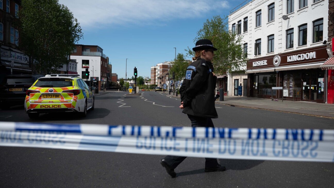 British police investigate the scene after two people were injured in a stabbing attack in the Golders Green area of north London on April 29, 2026. (Rasid Necati Aslim/Anadolu via Getty Images)