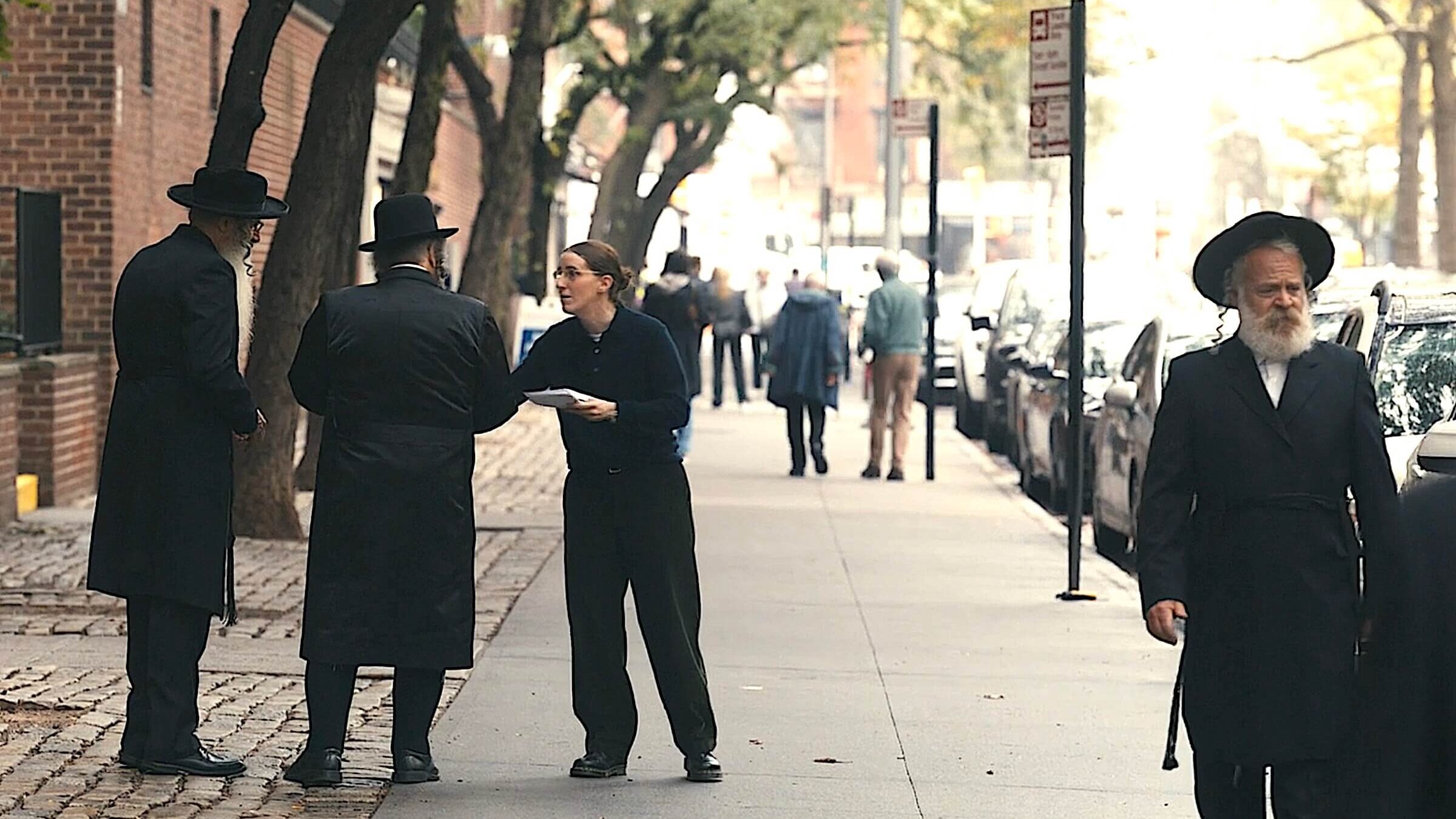 Robbie Hoffman, who plays Randi, handing out fliers in a Hasidic neighborhood.