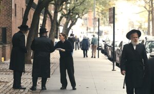 Robbie Hoffman, who plays Randi, handing out fliers in a Hasidic neighborhood.
