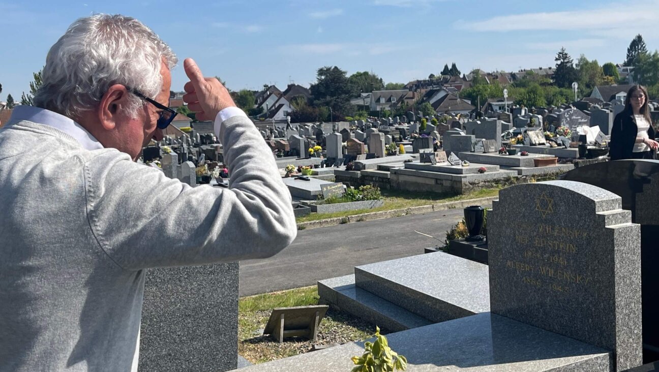 Alain-Sam Federowski ponders his family gravestone, with a spot reserved for himself.