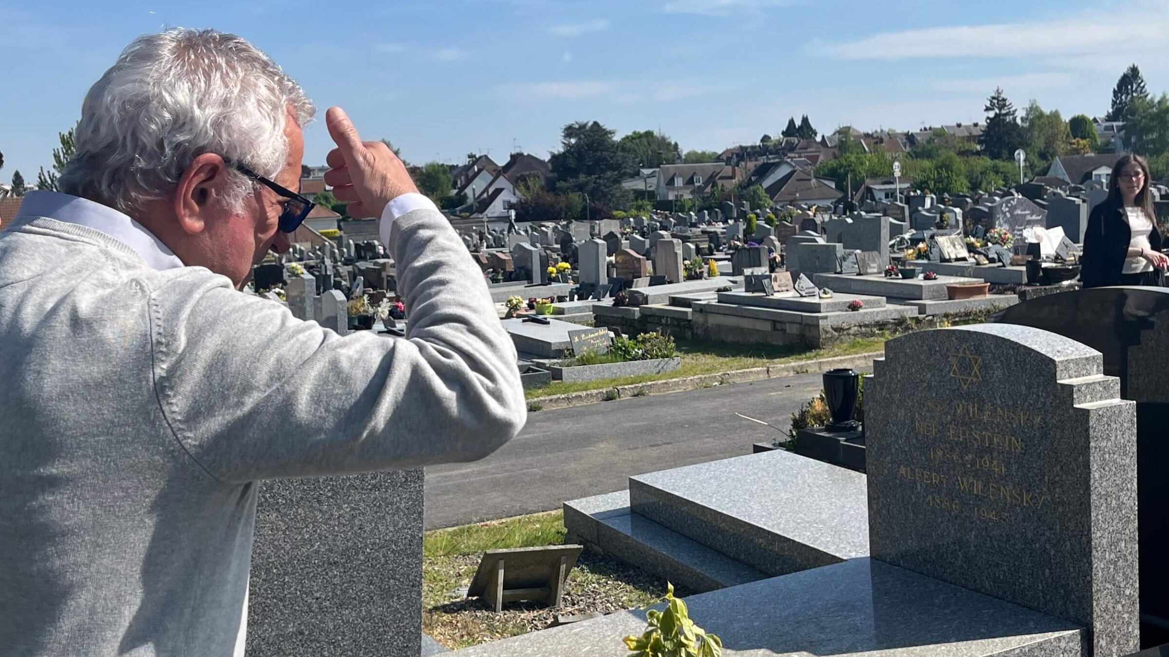Alain-Sam Federowski ponders his family gravestone, with a spot reserved for himself.
