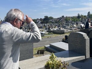 Alain-Sam Federowski ponders his family gravestone, with a spot reserved for himself.