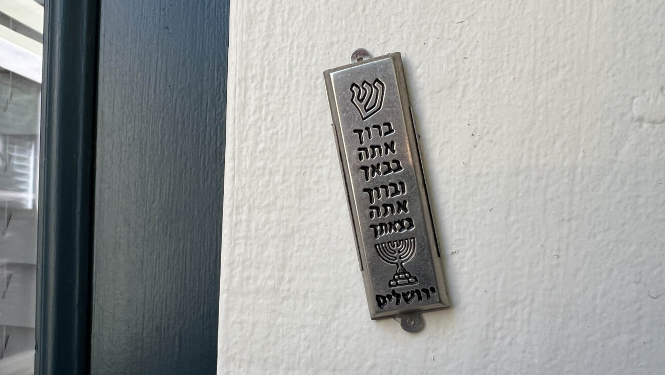 A mezuzah attached to a door frame.