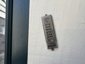 A mezuzah attached to a door frame.