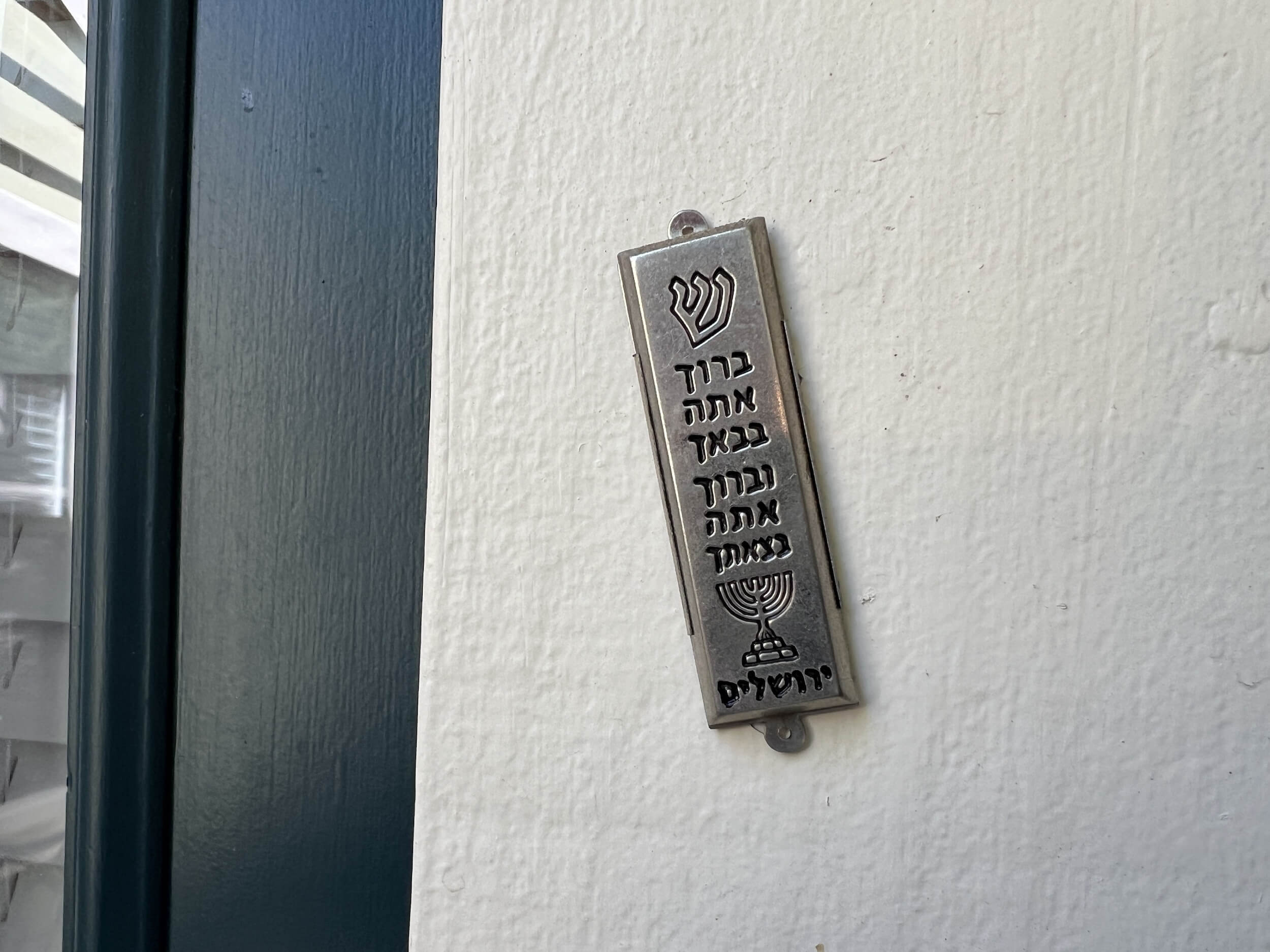 How can I live freely as a Jew in a world where strangers rip my mezuzah off my...