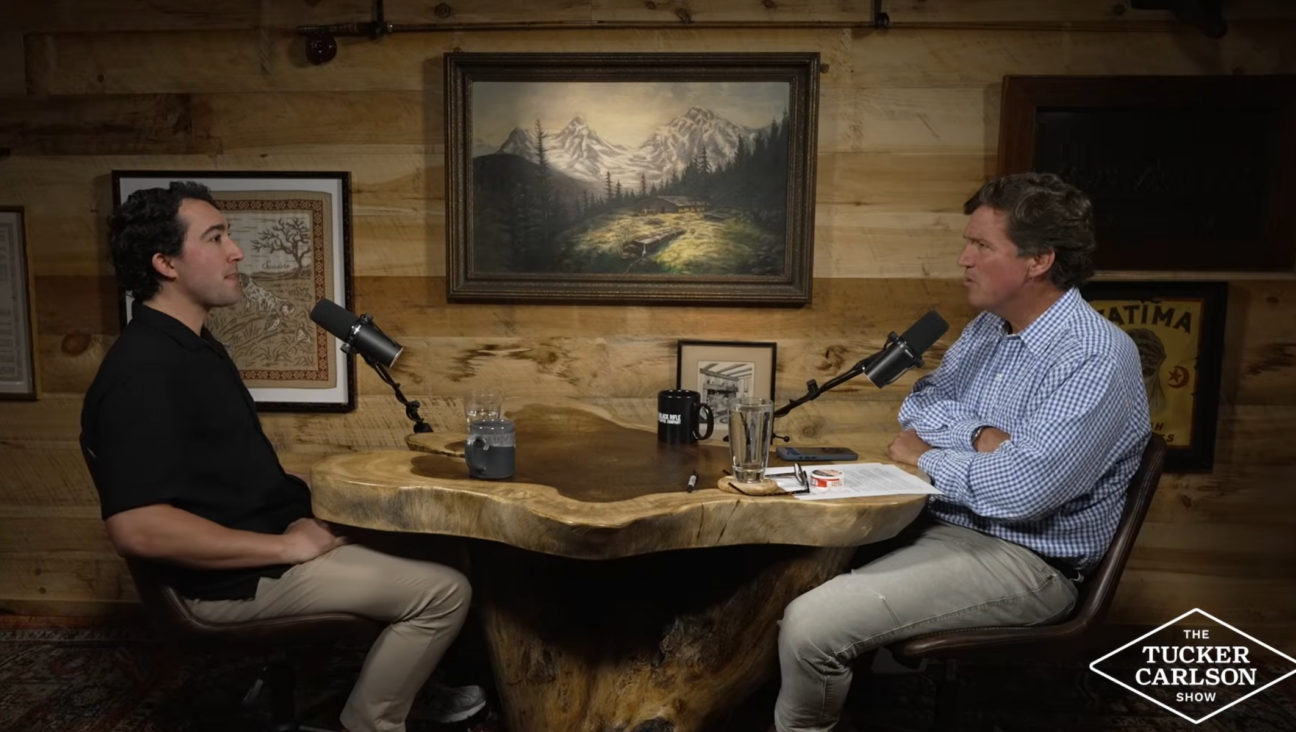 Tucker Carlson interviews Tyler Oliveira on May 8, 2026. (Screenshot)