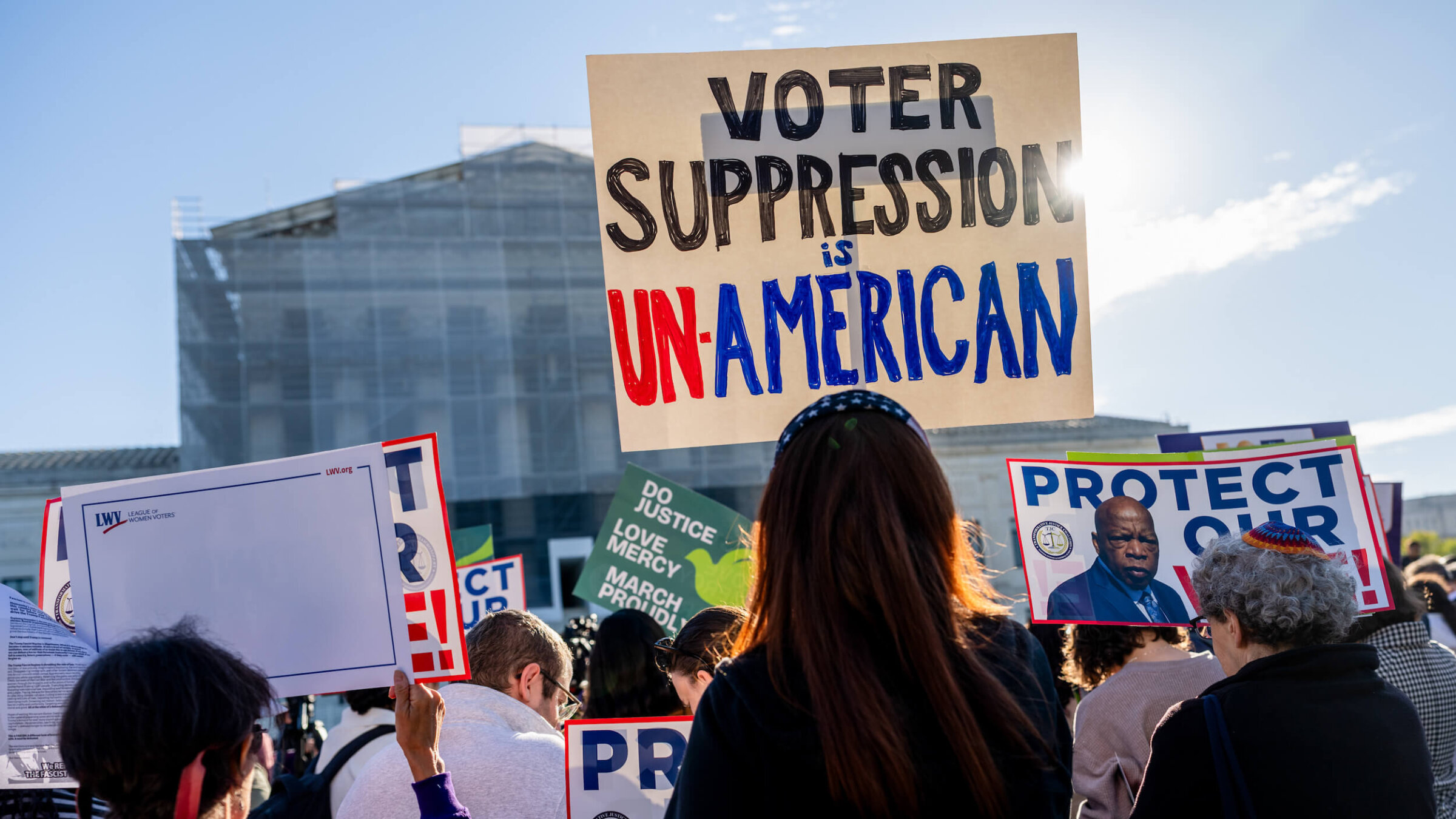 Demonstrators protest in favor of the Voting Rights Act outside the Supreme Court on Oct. 15, 2025.