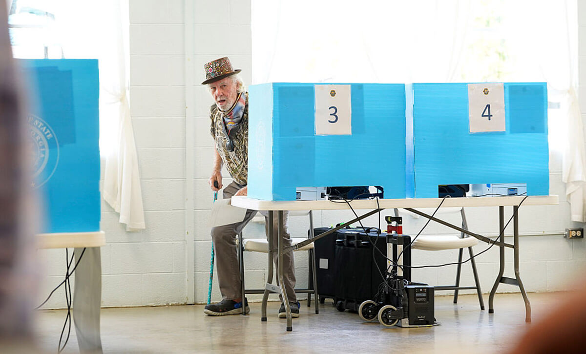 A man stands up from his voting booth in a special election on April 7, 2026 in Rome, Georgia.
