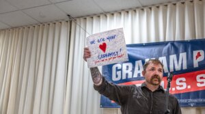 Democratic U.S. Senate candidate Graham Platner holds up a handwritten card signed by supporters present at a town hall at the Elks Lodge 188 on June 7, 2026 in Portland, Maine. Platner is the presumptive Democratic nominee and will face incumbent Sen. Collins (R-ME) for Maine’s U.S. Senate seat in the general election. (Laura Brett/Getty Images)