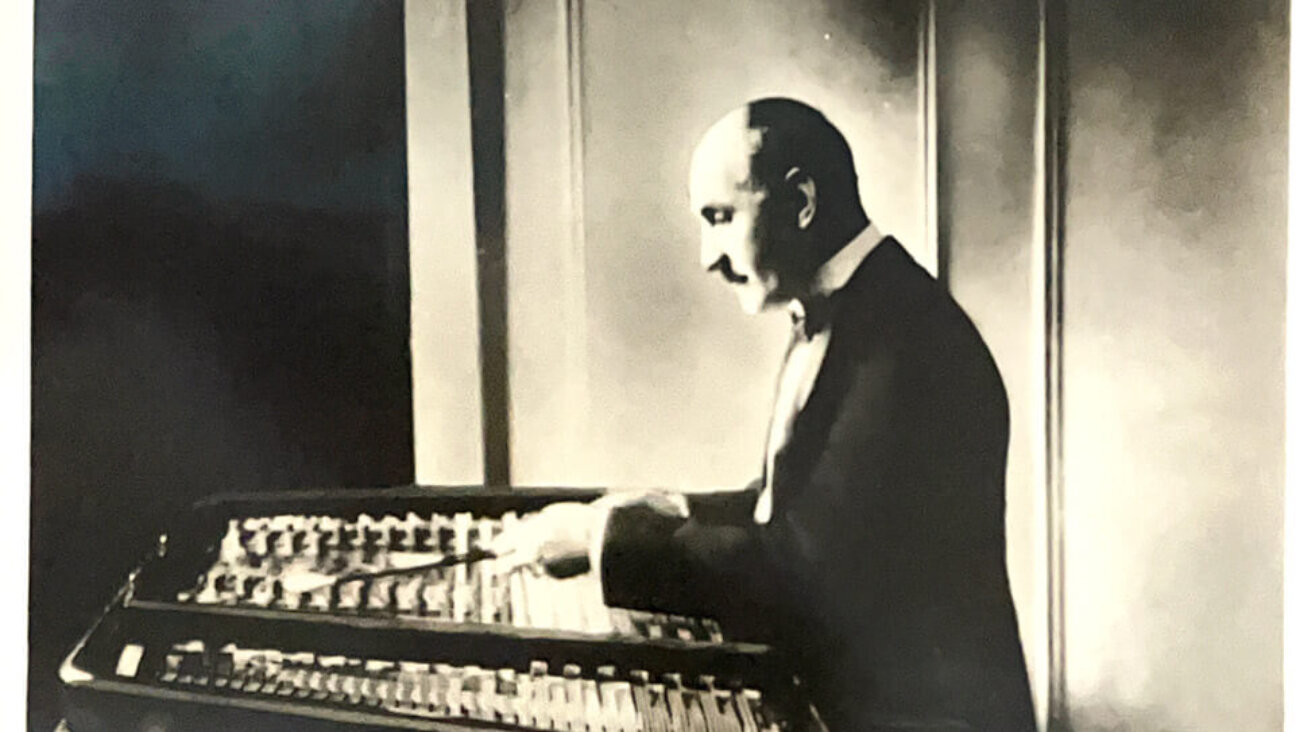 Joseph Moskowitz at the instrument that brought him fame.