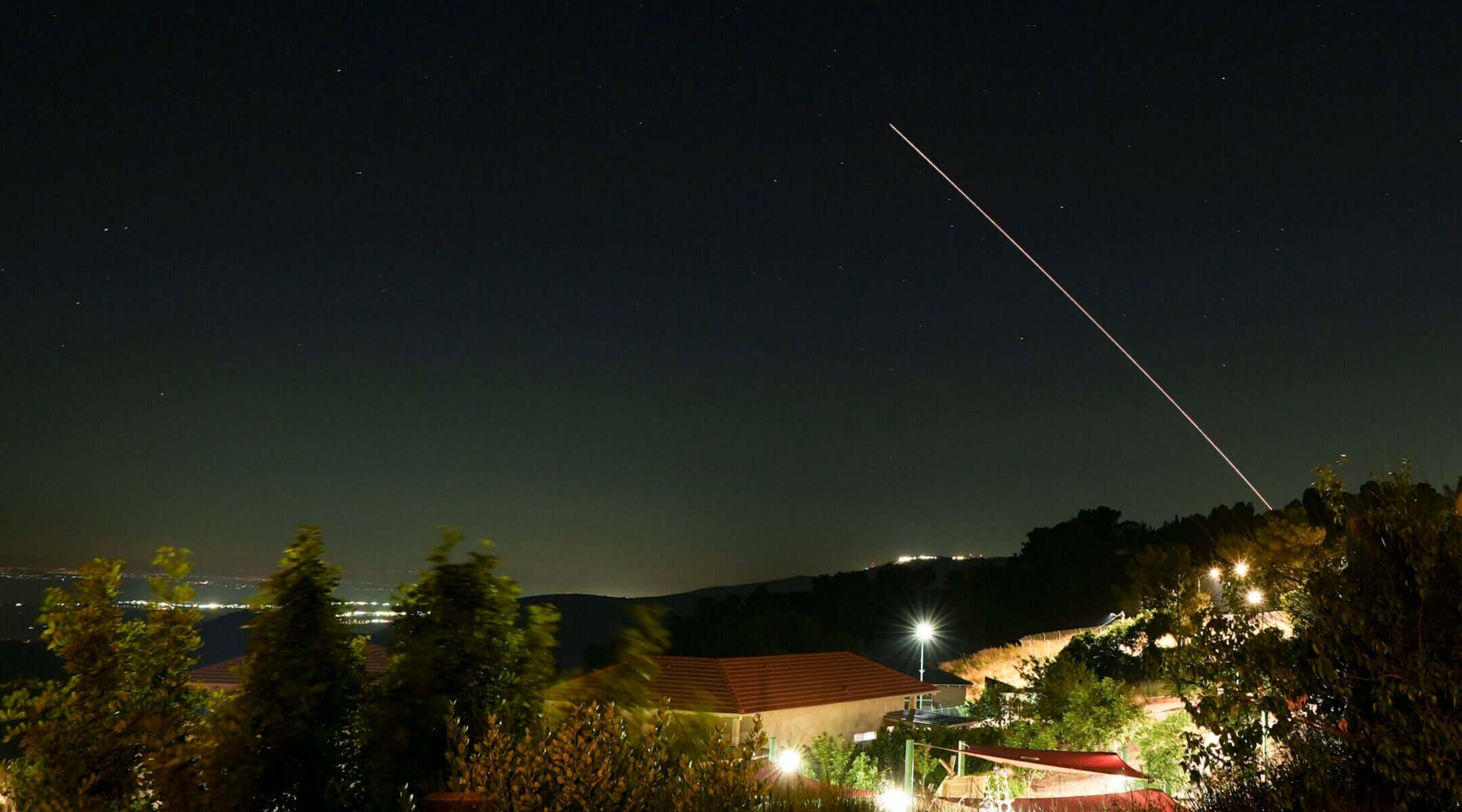 Anti-missile batteries fire interception missiles toward incoming ballistic missiles launched from Iran, as seen over northern Israel, June 7, 2026.