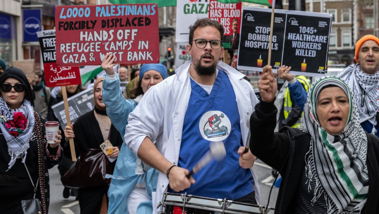 NHS workers from the Medics For Gaza arrive at the pro-Palestine rally at Israeli Embassy, March 22, 2025 in London. (Guy Smallman/Getty Images)