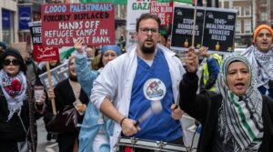 NHS workers from the Medics For Gaza arrive at the pro-Palestine rally at Israeli Embassy, March 22, 2025 in London. (Guy Smallman/Getty Images)
