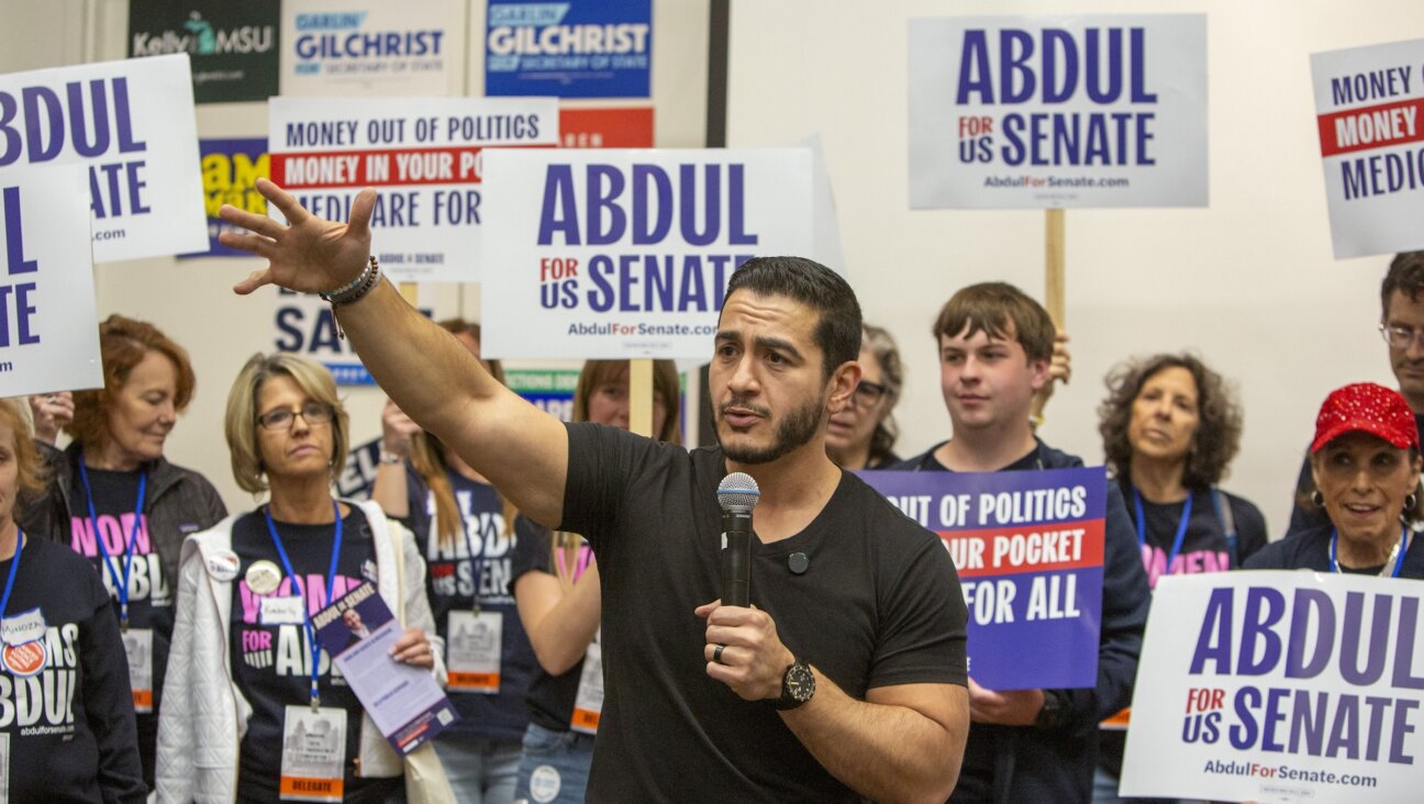 Michigan senate candidate Abdul El-Sayed campaigns for  at the Michigan Democratic Nominating Convention in April. 