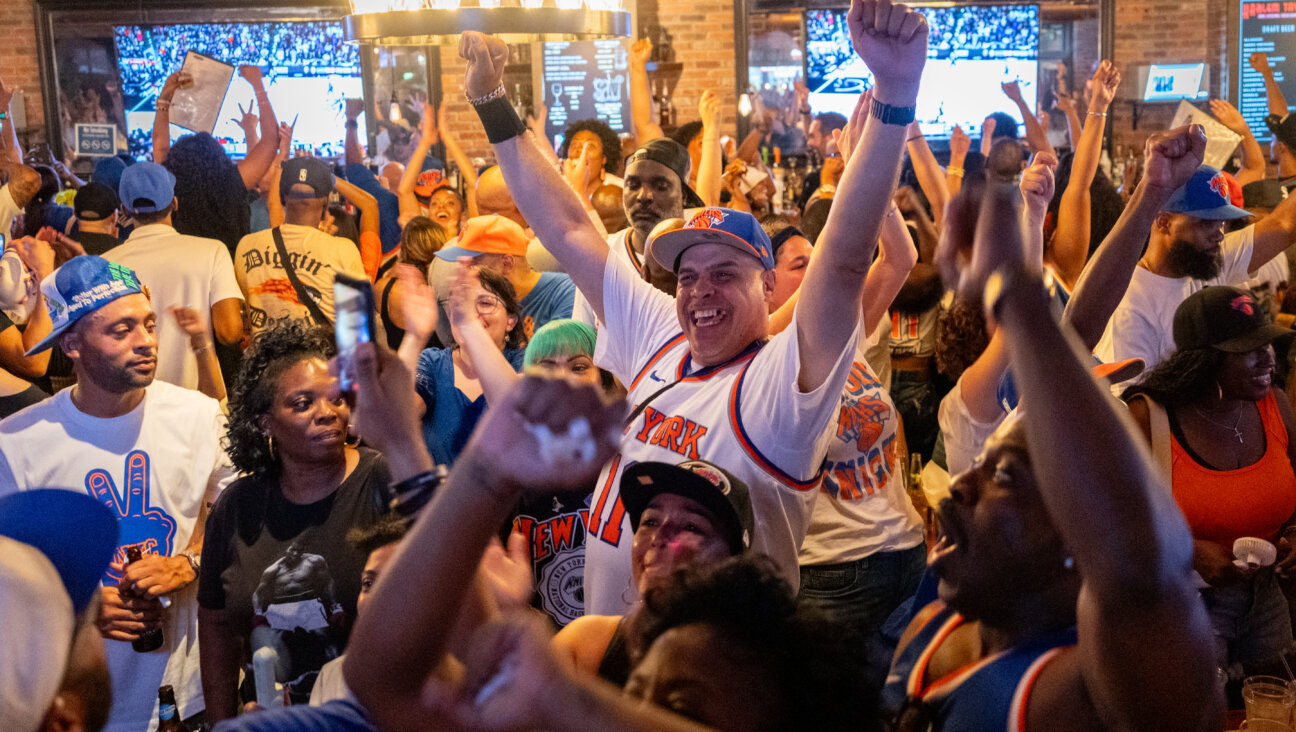 New Yorkers watch the closing moments of Game 5 of the NBA finals at Harlem Tavern on June 13, 2026 in New York City.