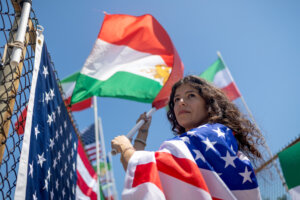 Mehrzad Mozhdekanloo protests FIFA restrictions while displaying the pre-1979 Iranian flag on Sunday, June 14, 2026 in Encino, CA.  