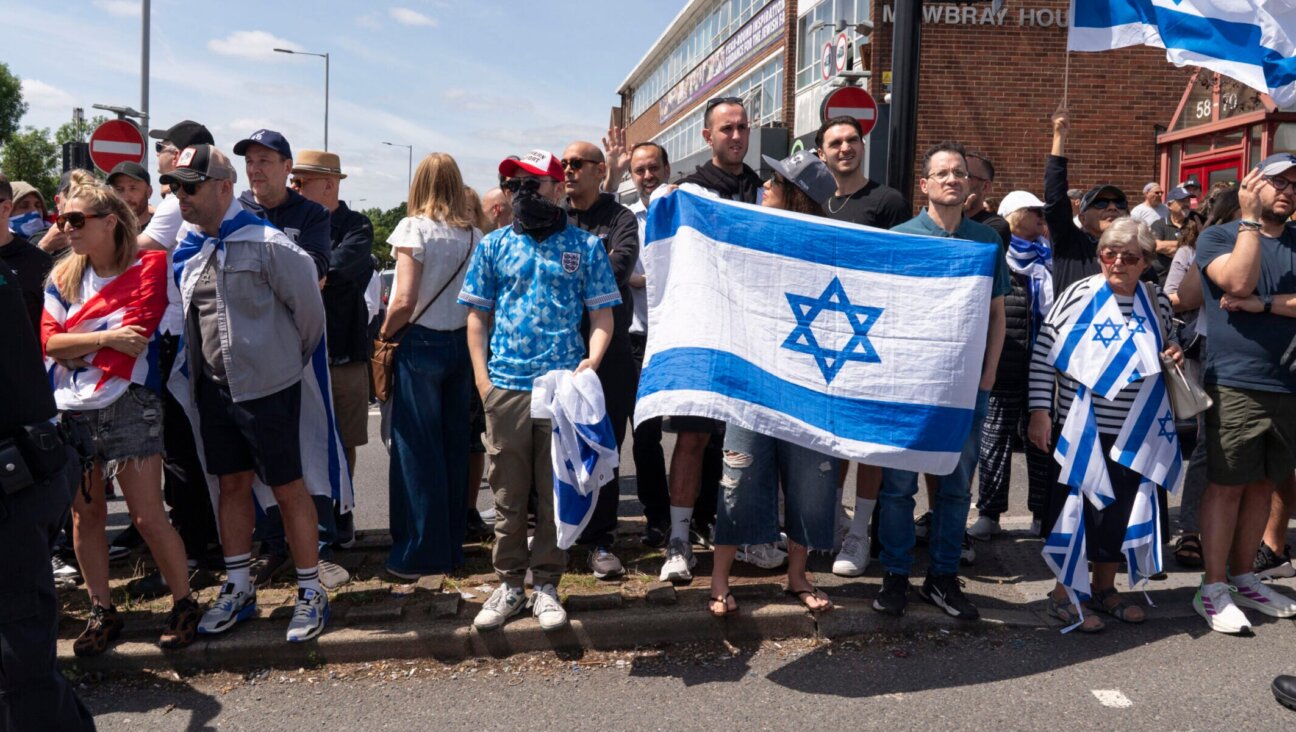 Pro-Israel counter-protesters face the main protest against the Great Israeli Real Estate Event at Edgware United Synagogue on June 14, 2026 in London. (Denise Baker/Getty Images)