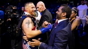 Justin Gaethje and FBI Director Kash Patel shake hands during the UFC Freedom 250 event on the South Lawn of the White House on June 14, 2026 in Washington, D.C. (Michelle Farsi/Zuffa LLC)