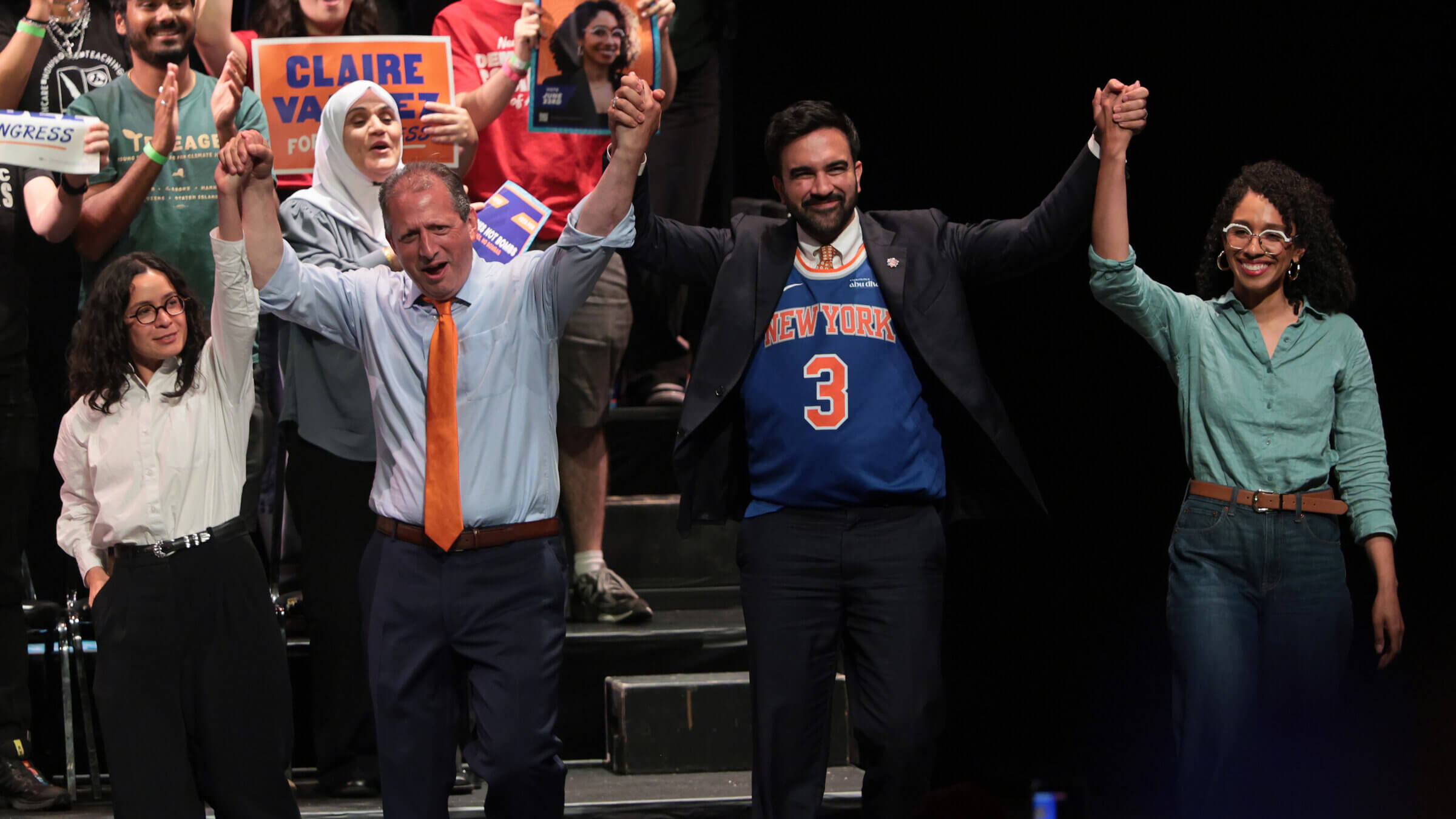 Congressional candidate Claire Valdez, Congressional candidate Brad Lander, Mayor Zohran Mamdani, and Congressional candidate Darializa Avila Chevalier raise their hands during a rally at King's Theater in New York City.