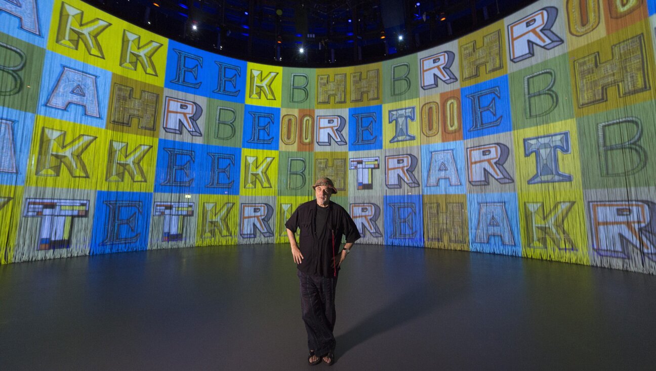 Rod Arad stands near the screen into the art installation 'Curtain Call.' London, 2016.