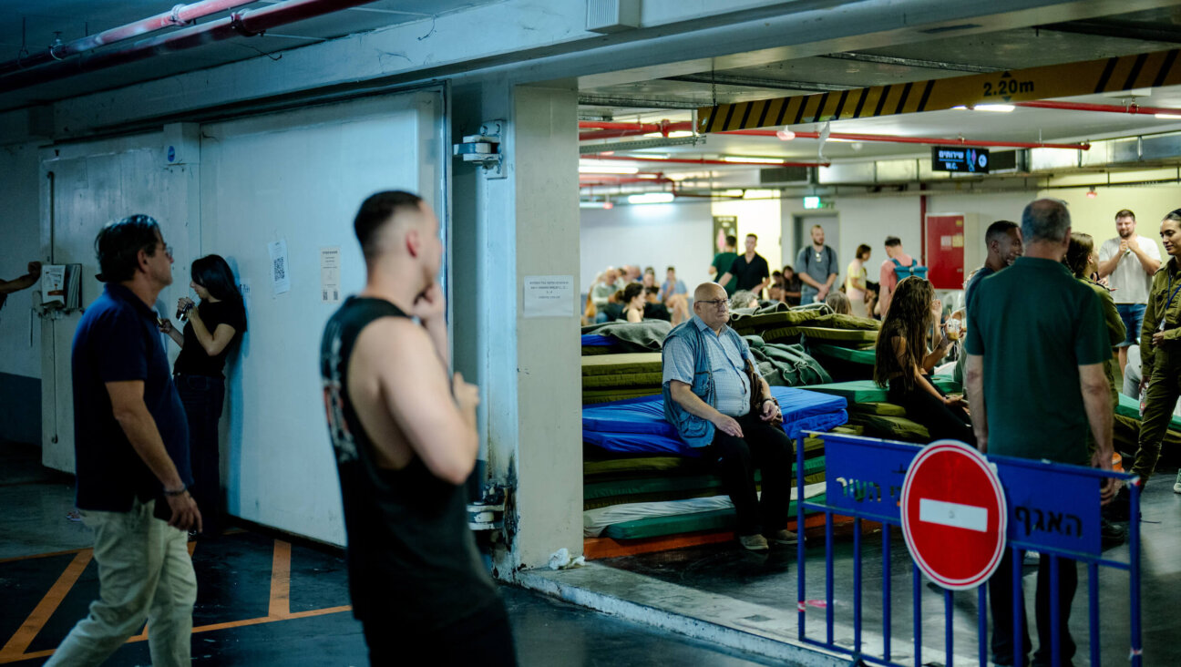 Israelis seek shelter underground in Tel Aviv on June 8, as Iran and Israel once again traded attacks.