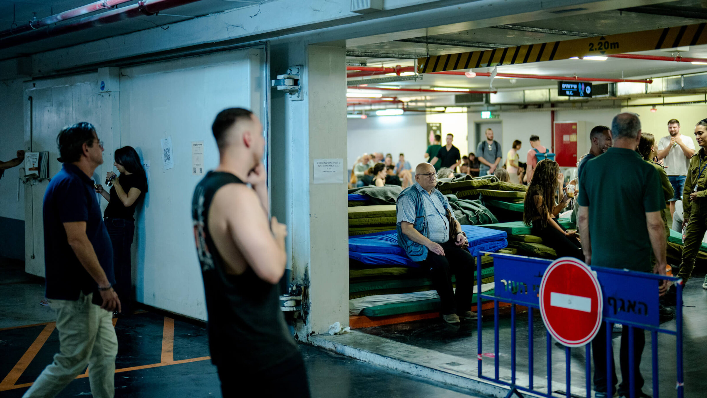 Israelis seek shelter underground in Tel Aviv on June 8, as Iran and Israel once again traded attacks.