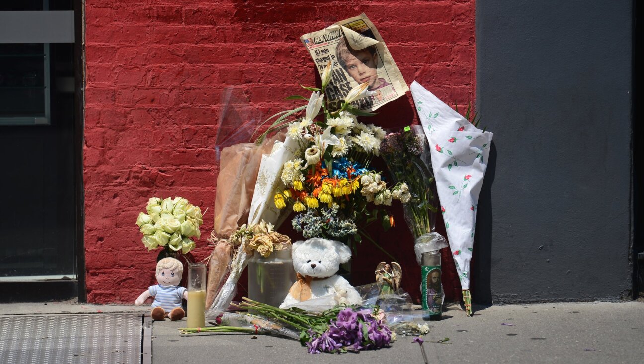 A street shrine to six-year-old Etan Patz is set in front of the building where suspect Pedro Hernandez confessed to have strangled the boy in New York on May 29, 2012.