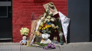 A street shrine to six-year-old Etan Patz is set in front of the building where suspect Pedro Hernandez confessed to have strangled the boy in New York on May 29, 2012.
