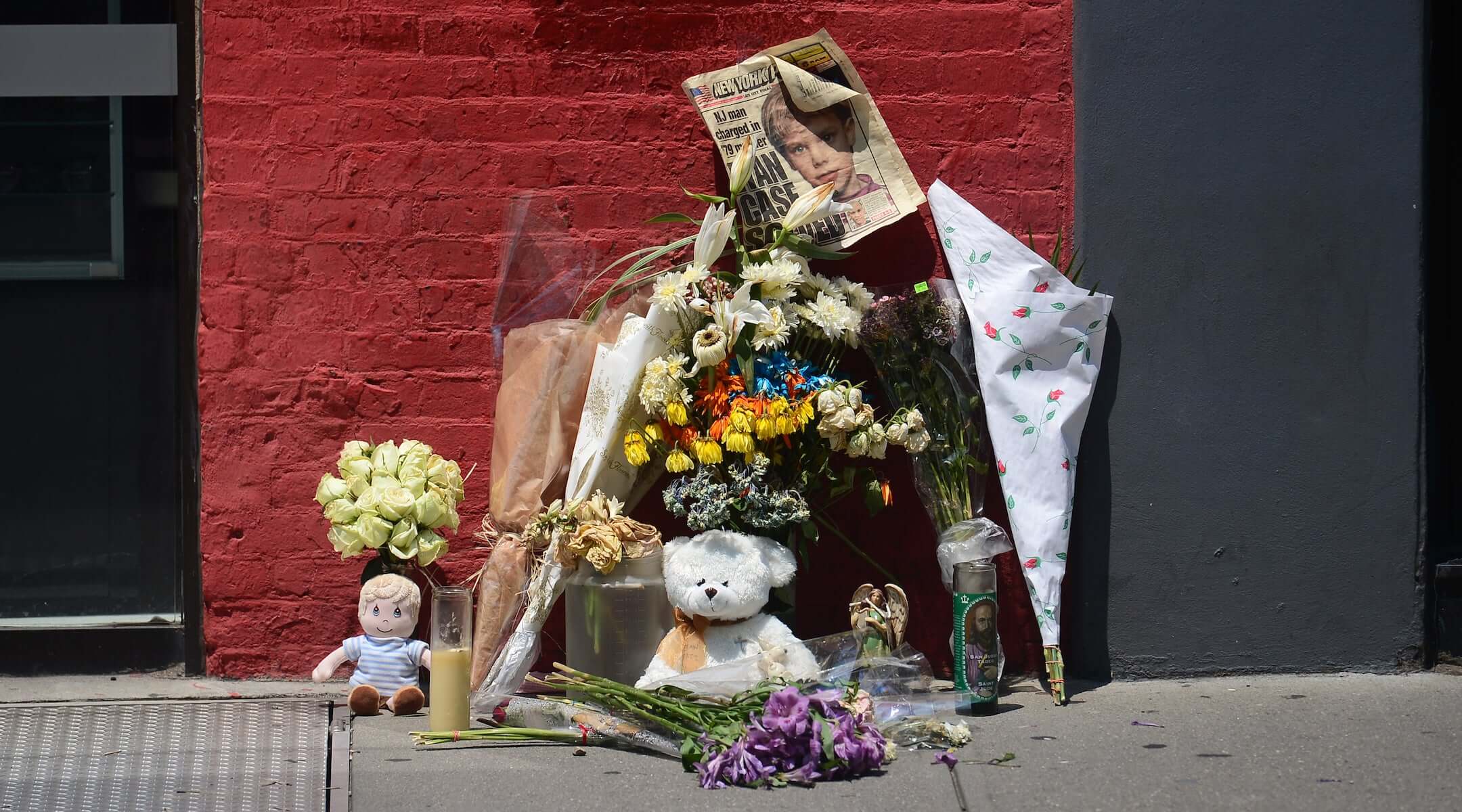 A street shrine to six-year-old Etan Patz is set in front of the building where suspect Pedro Hernandez confessed to have strangled the boy in New York on May 29, 2012.