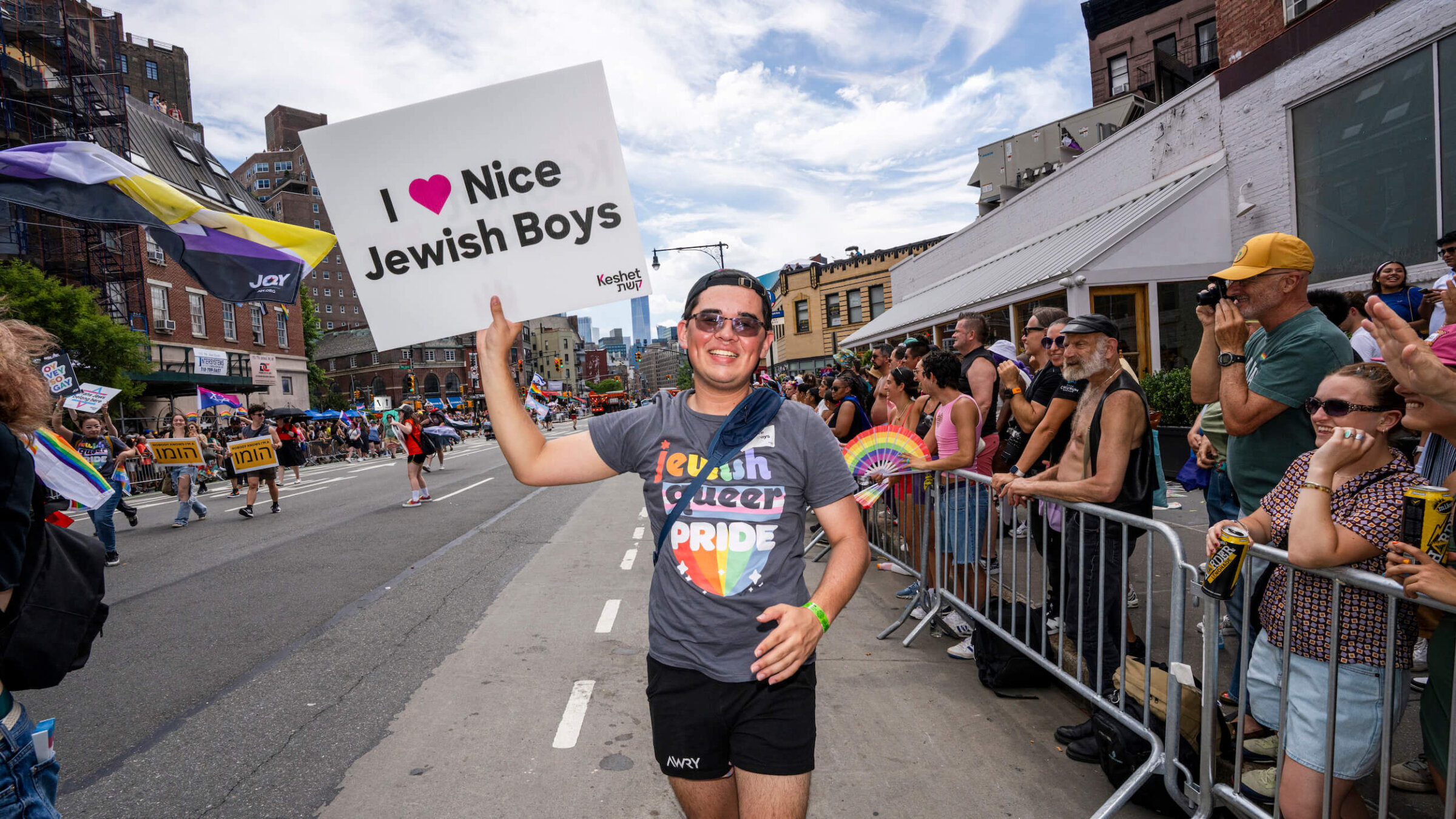 A man carrying a sign from the Jewish LGBTQ+ organization Keshet takes part in the 2025 NYC Pride March on June 29, 2025.